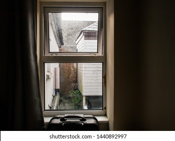 View From A Dirty Window On A Small Ugly Backyard, Travel Case , Concept: Budget And Cheap Holiday,  Rented Rooms, 