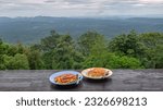 View of a dish of fried eggs over rice at Pha Trom Jai Cliff, Khao Yai National Park, Nakhon Nayok, Thailand 