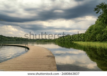 a view of the dock and lake baths at Almind Lake in the Danish Lake District near Silkeborg