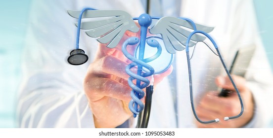 View of a Doctor holding a 3d redering medical cadaceus and stethoscope