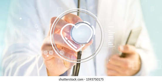 View Of A Doctor Holding A Heart Icon Surrounded By Data