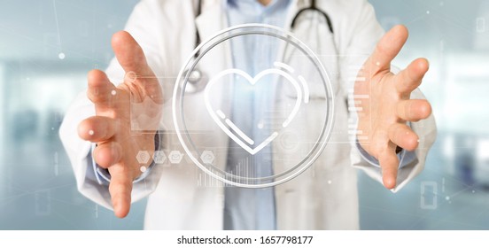 View of a Doctor holding a heart icon surrounded by data - Shutterstock ID 1657798177