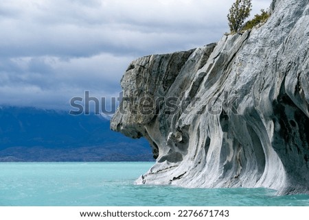 View of the Dog head profile at the Marble Caves on Lake General Carrera, Patagonia, Chile. Marble Caves are naturally sculpted caves made completely of marble and formed by the water action.