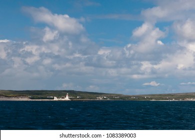 View from Doolin Ferry travelling Galway Bay to Inishmore, looking southwest toward the lighthouse of Straw Island.  Aran Islands, County Galway, Republic of Ireland.  