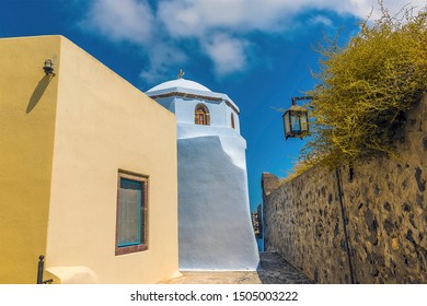 A View Down The Castle Walls In Pyrgos, Santorini In Summertime