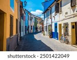 A view down a colourful street in the village area of San Giuliano in Rimini, Italy in summertime