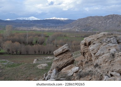 A view down hills and cliffs.