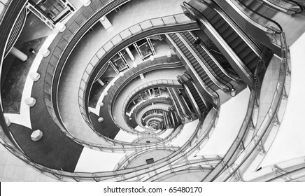View down in a modern hall. Image looks like infinity twisted spiral.