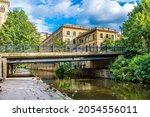 A view down the River Aire in the centre of the model village of Saltaire, Yorkshire, UK in summertime