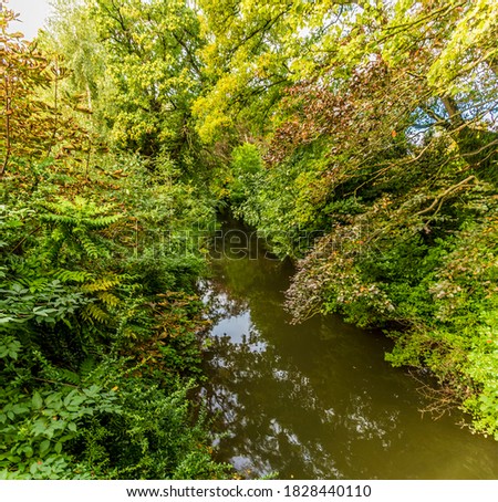 A view down the River Eye in New Park, Melton Mowbray, Leicestershire, UK in the summertime