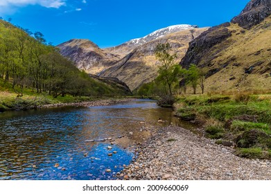 A view down the River Nevis from the Steall Waterfall in Glen Nevis, Scotland on a summers day - Shutterstock ID 2009660069