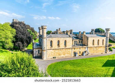 A view down the side of  Lincoln Castle past the Lincoln Crown Court in Lincoln, Lincolnshire in summertime