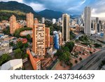 View of the downtown center in Santa Fe district, with Santamaria Bullring (Plaza de Toros), modern skyscrapers and Monserrate sanctuary in day light, Bogota city, Colombia