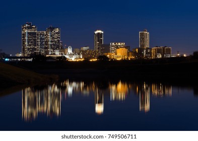 View of Downtown Fort Worth at twilight a city park with the Trinity River reflecting the skyline - Shutterstock ID 749506711