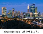 A view of downtown Perth at night in the blue hour. Tall skyscrapers can be seen.