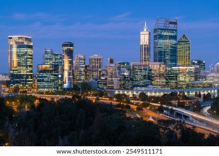 A view of downtown Perth at night in the blue hour. Tall skyscrapers can be seen.