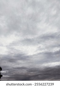 View of a dramatic overcast sky filled with gray clouds, creating a gloomy atmosphere.
