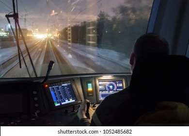 View from the driver's cab of an electric train, a night voyage on a railway