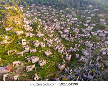 View from drone of ancient ruined settlement of Kayakoy with deserted houses and churches on mountain slope in Mugla Province, Turkey