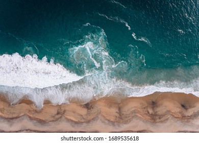 View from a drone to a cape and Pacific coast at sunset in Mexico