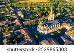 View from drone of houses of Mirepoix town and cathedral of St-Maurice at sunny summer day, France