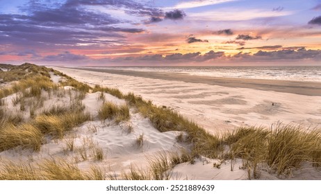 View from dune top over sunset in North Sea from the island of Ameland, Friesland, Netherlands