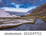 View during sunrise from Rupin pass trek campsite.This trek is full of diversity from majestic Himalayan ranges to waterfalls, glacial meadows, snow-covered landscapes, lush forests in Himachal, India