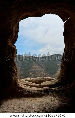 View from the dwelling in the cave. A passage carved in stone.