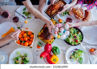 View At Easter Holiday Table With Food. Family Hands 