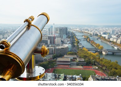 A View From The Eifel Tower In Paris And A Telescope By The Left Side