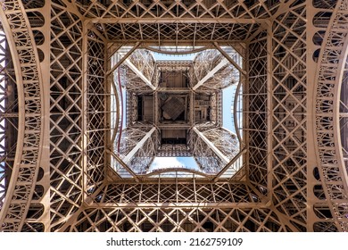 View of the Eiffel tower seen from below in Paris, France. Architecture and monuments of Paris. Paris postcard