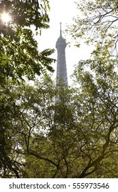 View of Eiffel tower through trees against sky at Paris; France