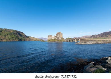 View of the Eilean Donan Castle and it's lake in a sunny day at the morning. Scotland, UK