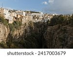 View of El Kantara bridge over Rhumel river gorge in Constantine city. Algeria. Africa.