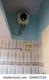 View Of Electric Geyser Fitted On Top Wall Inside Bathroom