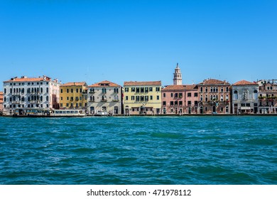 View of embankment in the Dorsoduro district of Venice. Colorful facades of the old medieval houses. Venice, Italy.