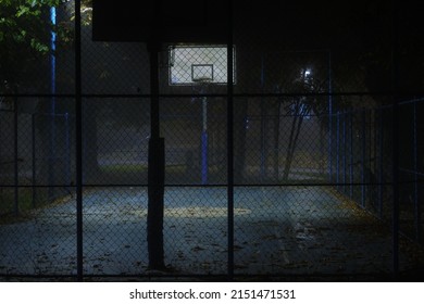 A view of a empty basketball court at night in Cluj