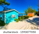 The view of empty beach on Half Moon Cay island at Bahamas. Blue water and white sand