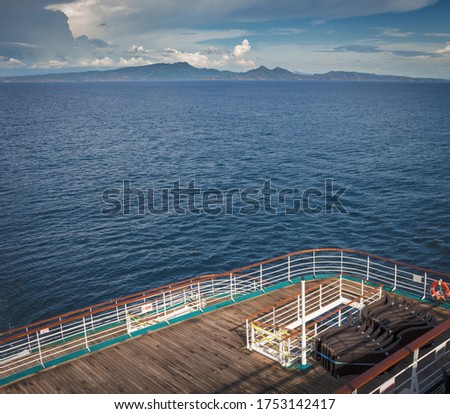 The view from an empty cruise ship deck.  Cruise ships currently have only crew on board and public spaces are mostly packed up for lockdown.