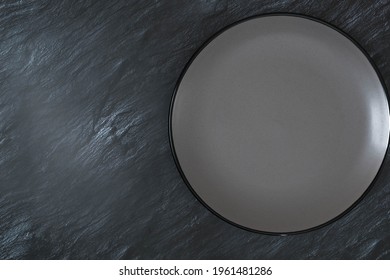 The View Of Empty Grey Plate On The Table.  Gray Plate Is On Kitchen Tabletop. This Is Copy Space.