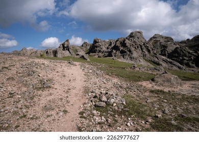 View of the empty hiking path across the rocky hills.	