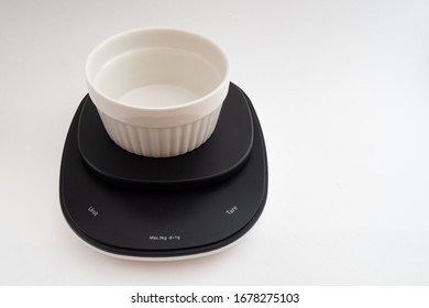 View Of An Empty Ramekin Placed On A Digital Kitchen Scale