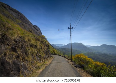 view of an empty road and mountains in background