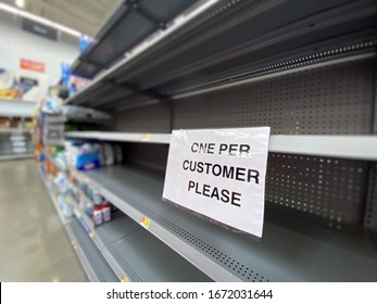 A view of empty shelves at a department store during the Coronavirus pandemic of 2020. - Shutterstock ID 1672031644