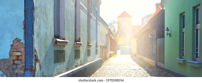 A view of the empty street through the old houses in a city center. No people because of coronavirus (COVID-19) outbreak in Ventspils, Latvia quarantine zone
