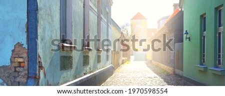 A view of the empty street through the old houses in a city center. No people because of coronavirus (COVID-19) outbreak in Ventspils, Latvia quarantine zone
