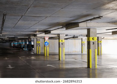 View of empty underground parking with dedicated spots