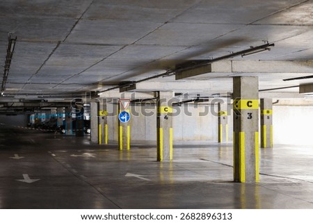 View of empty underground parking with dedicated spots