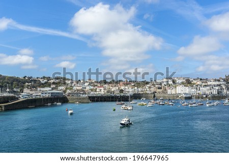 View from English Channel to town of Saint Peter Port, Guernsey, UK. Saint Peter Port - capital of Guernsey as well as main port.