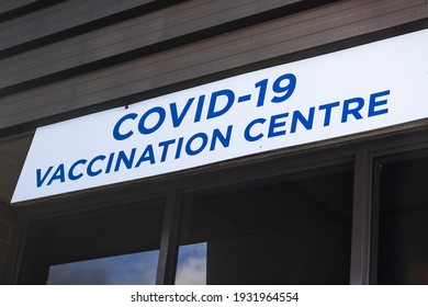 View Of Entrance Building With Sign Covid-19 Vaccination Centre In Nanaimo, Canada